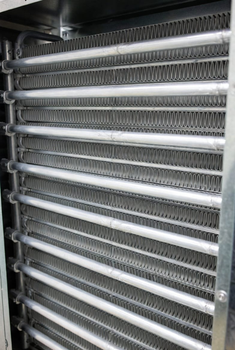 The Coil Conundrum: How Evaporator and Condenser Coil Design Dictates HVAC Efficiency and Longevity